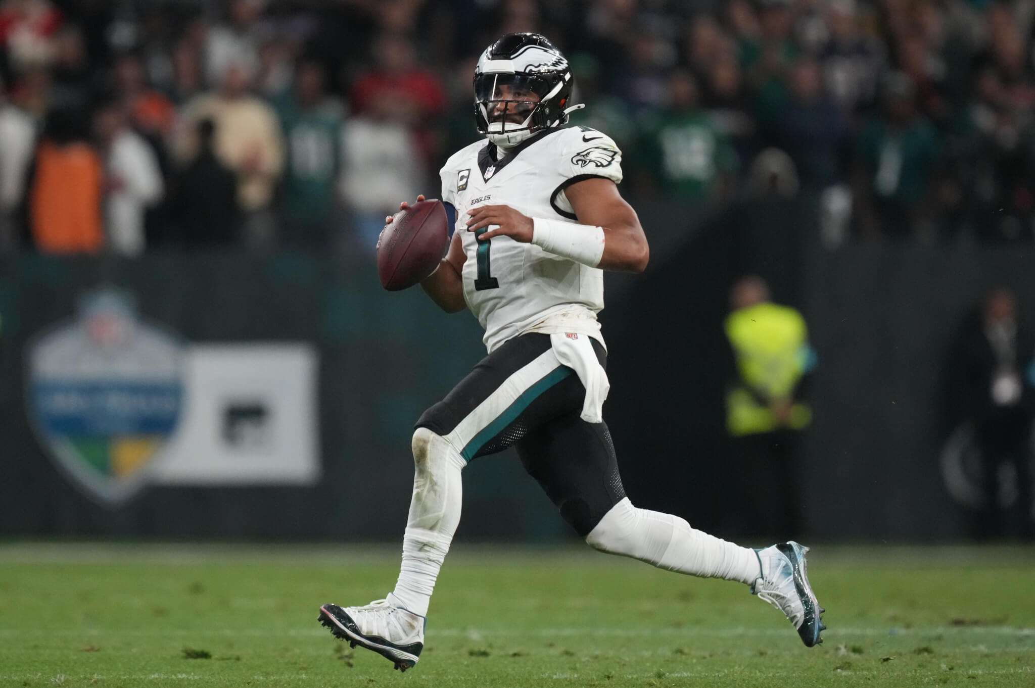 Philadelphia Eagles quarterback Jalen Hurts scrambling out of the pocket