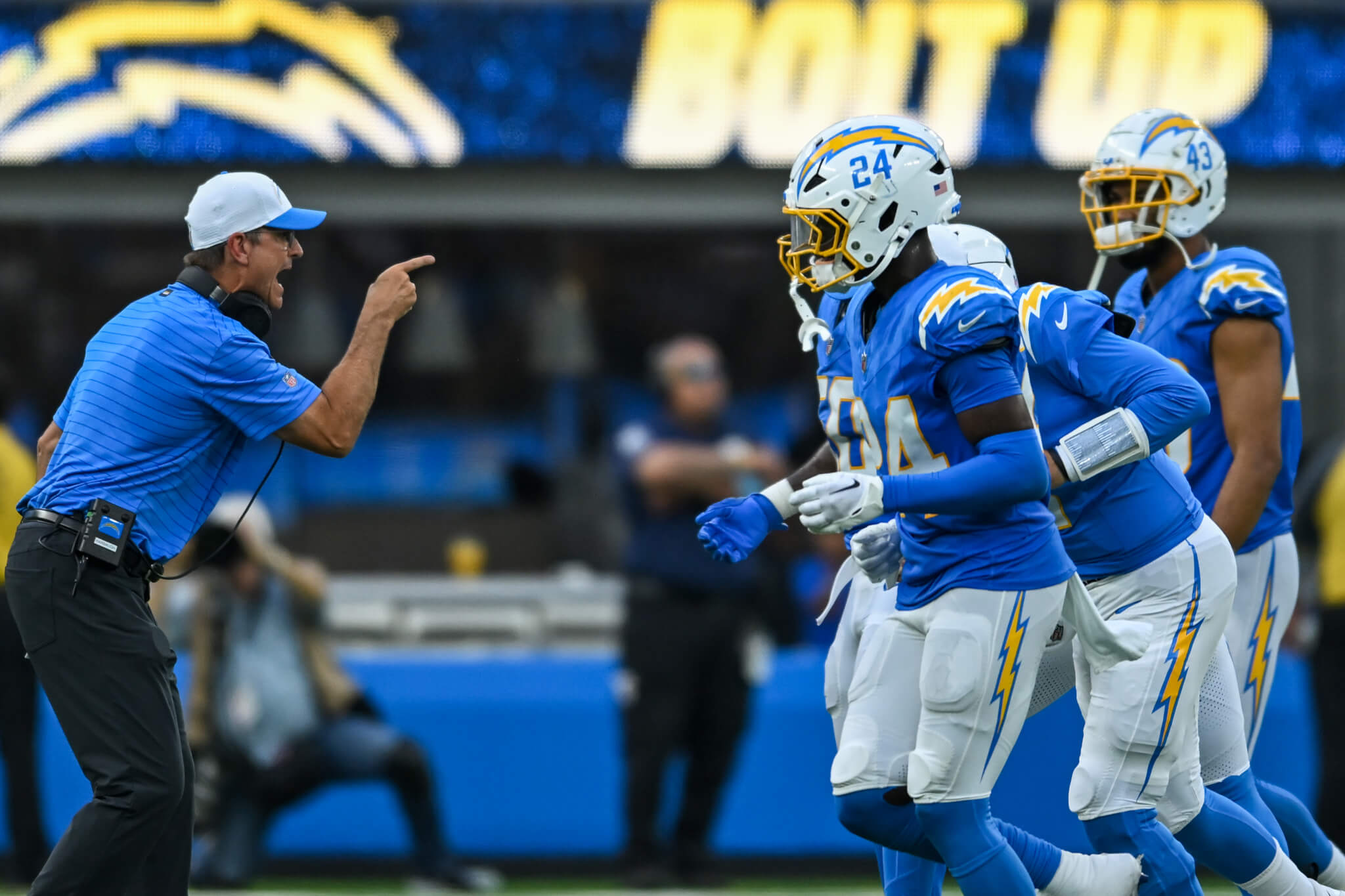 Los Angeles Chargers head coach Jim Harbaugh gesturing at his players