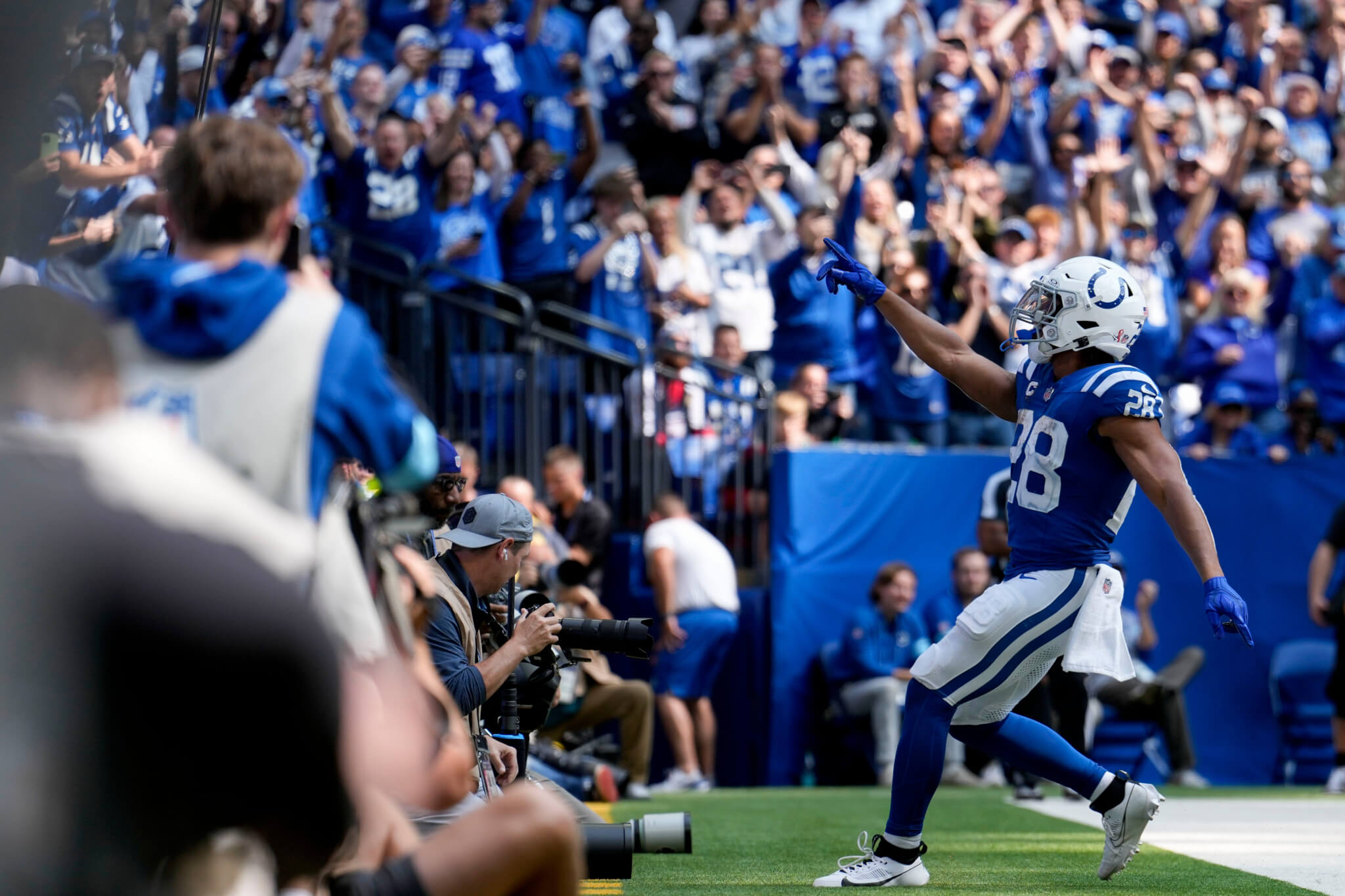 Jonathan Taylor celebrating with fans after scoring a touchdown