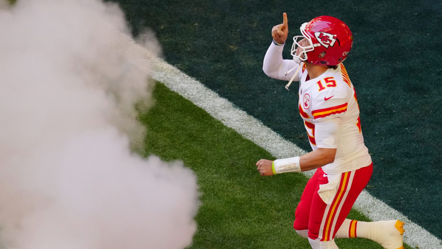 Patrick Mahomes running onto the field before Super Bowl 57